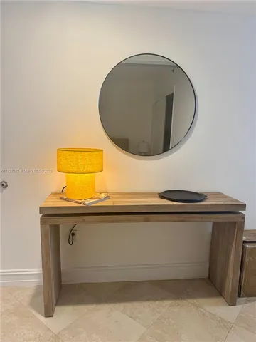 a bedroom with a bed and a rug