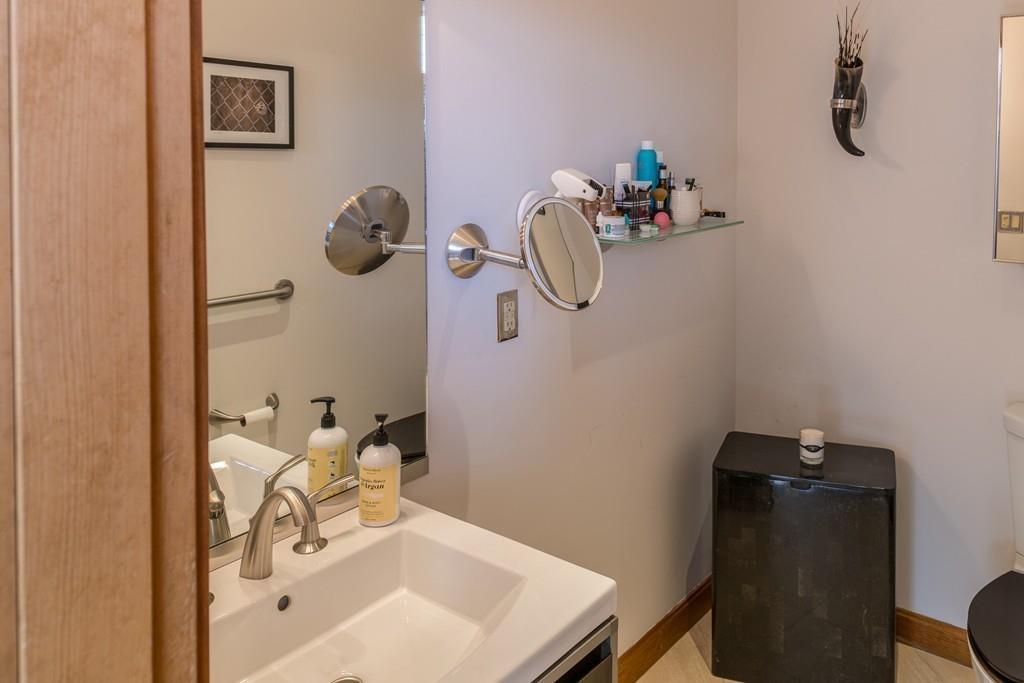 13 McKinley Road Marblehead, MA 01945 - Photo 14 of 36 a bathroom with a sink and mirror