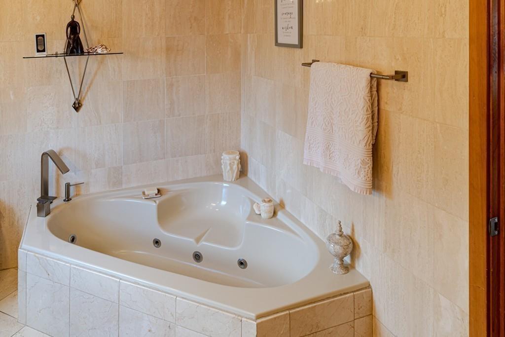 13 McKinley Road Marblehead, MA 01945 - Photo 20 of 36 a bathroom with a tub and shower