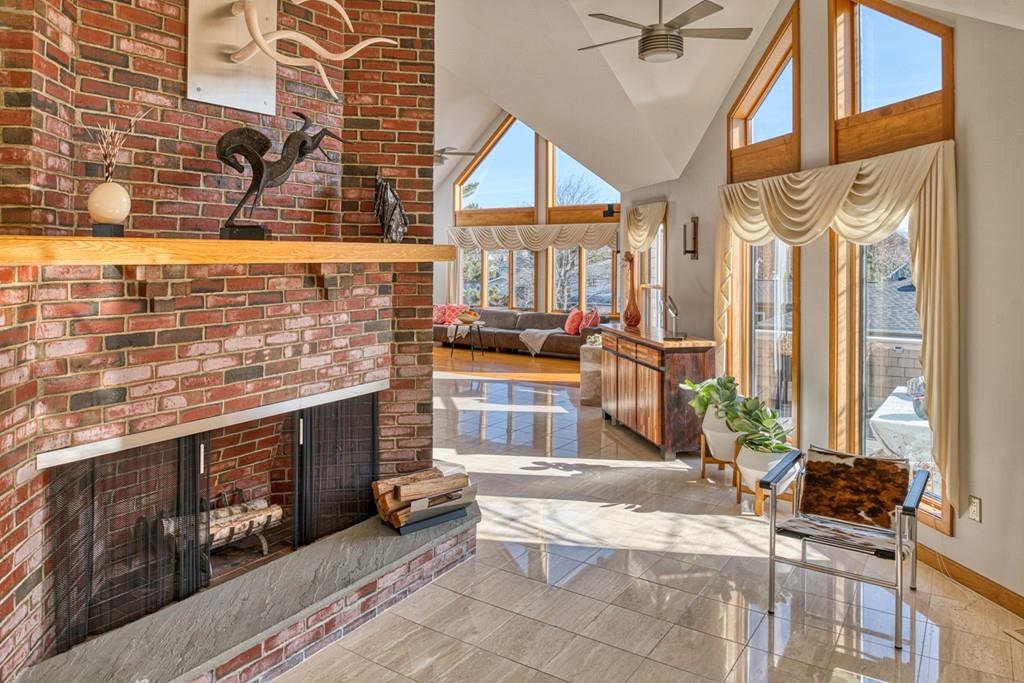 13 McKinley Road Marblehead, MA 01945 - Photo 2 of 36 a living room with fireplace furniture and a floor to ceiling window