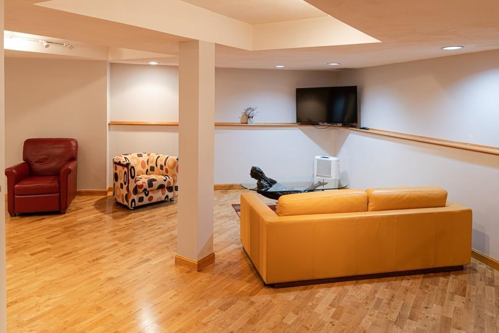 13 McKinley Road Marblehead, MA 01945 - Photo 25 of 36 a living room with furniture and a flat screen tv