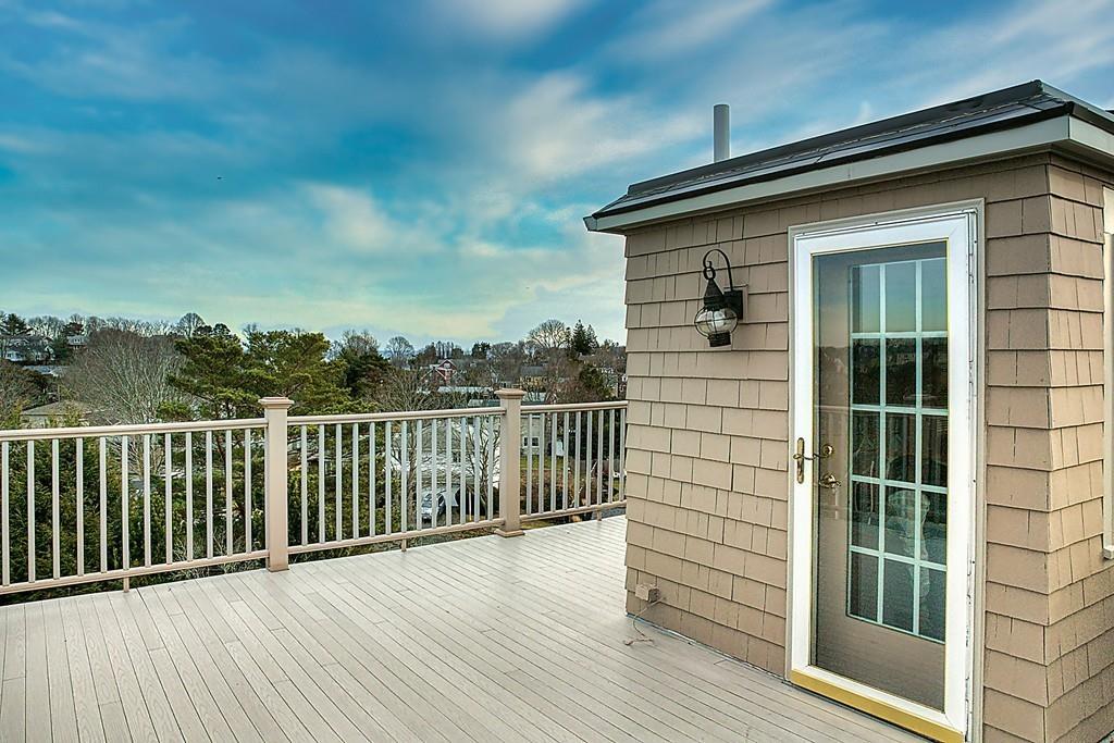 13 McKinley Road Marblehead, MA 01945 - Photo 30 of 36 a view of a balcony with wooden floor and fence