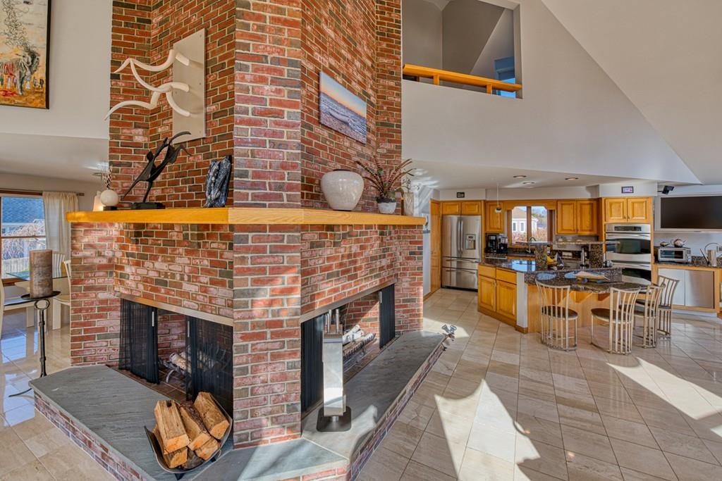13 McKinley Road Marblehead, MA 01945 - Photo 3 of 36 a open kitchen with stainless steel appliances granite countertop a barbecue grill and a fireplace