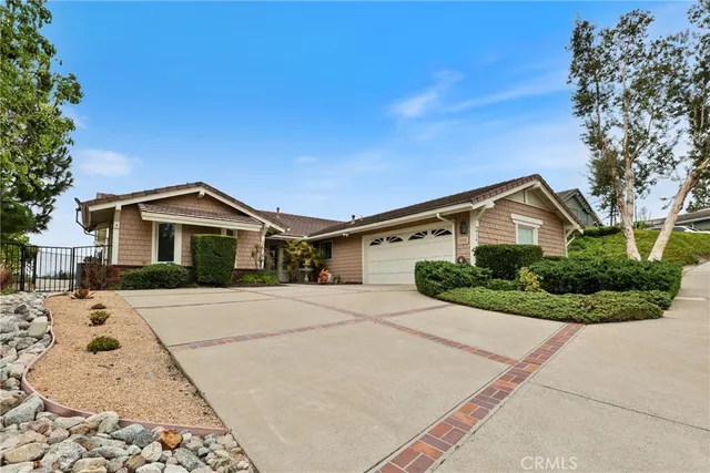 a front view of a house with yard