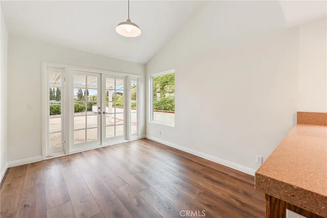 a view of front door and porch with wooden floor