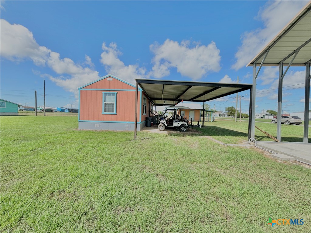 101 13th Street Seadrift, TX 77983 - Photo 17 of 42 a view of a house with backyard and a patio
