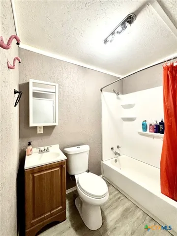 a bathroom with a toilet a sink and a bathtub