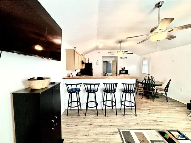 a dinning table and chairs in the patio of a house