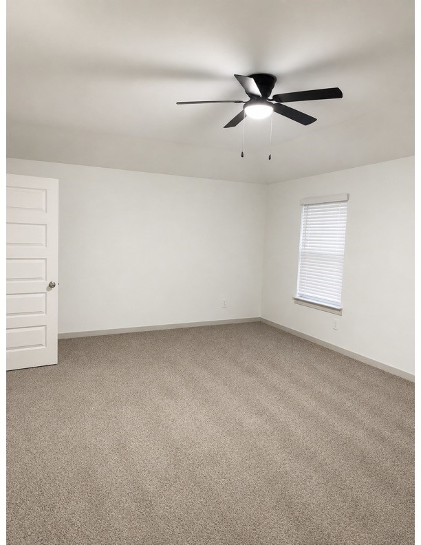 16 Desert Spring Lane Manvel, TX 77578 - Photo 3 of 11 Bedroom with a ceiling fan overhead, and natural light from a bright window.