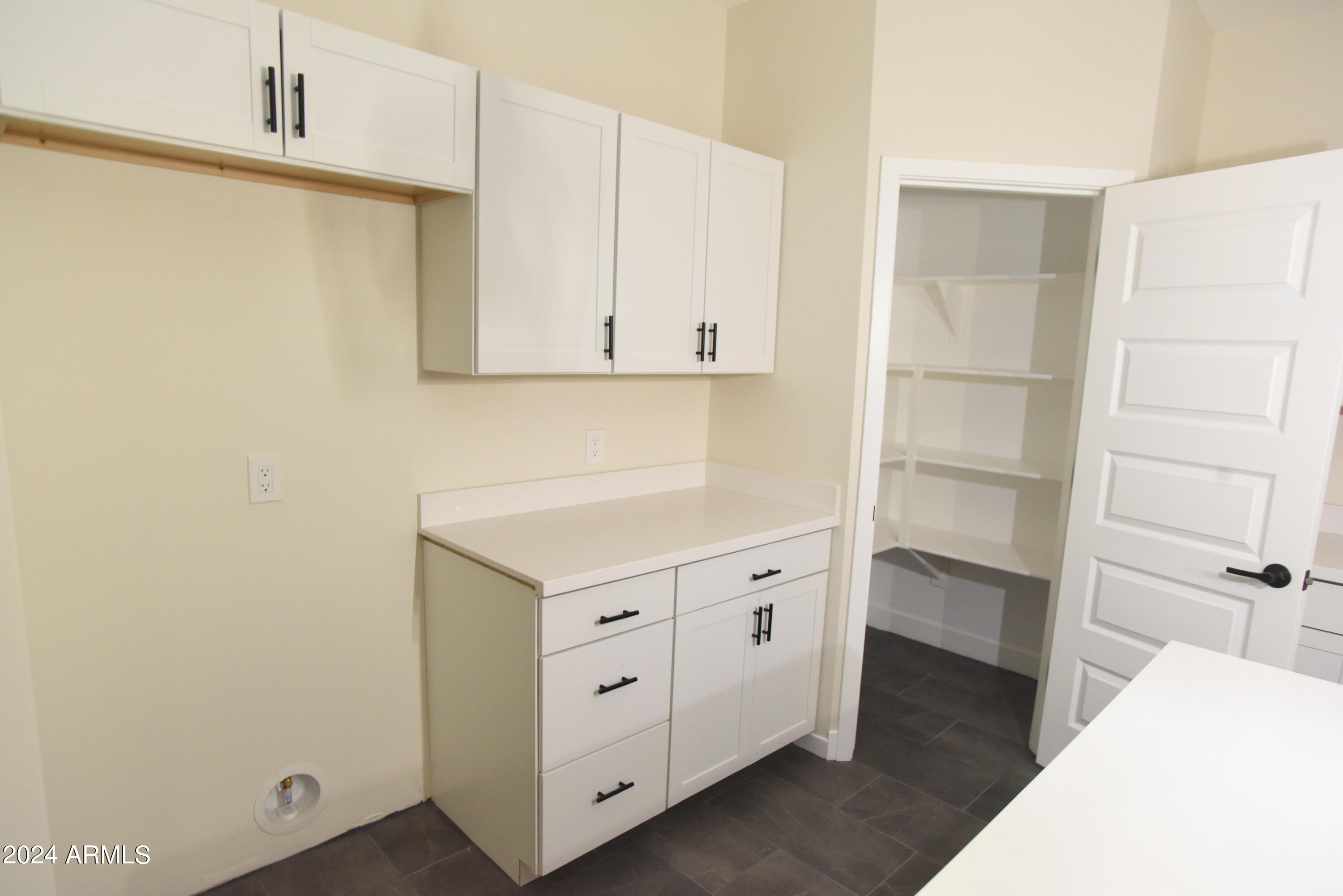 1028 South Wintersburg Road Tonopah, AZ 85354 - Photo 17 of 48 a view of cabinets with wooden floor