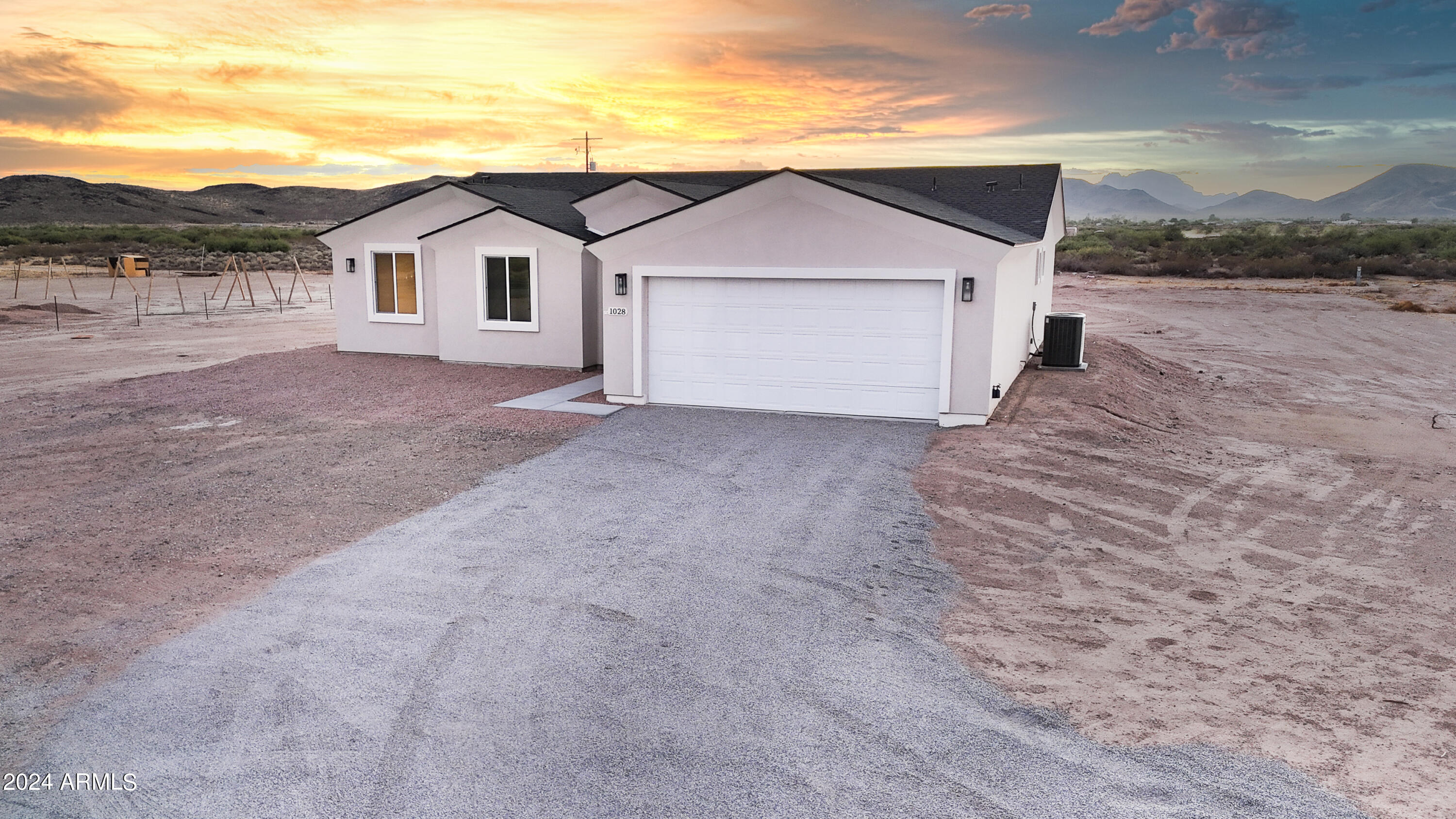 1028 South Wintersburg Road Tonopah, AZ 85354 - Photo 34 of 48 a view of a house with a yard