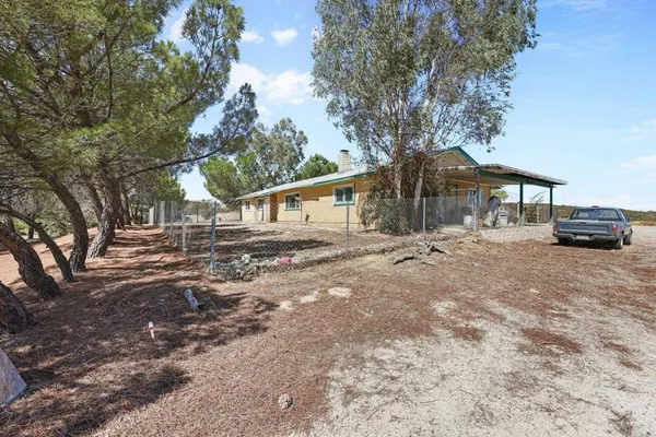 a kitchen with stainless steel appliances granite countertop a refrigerator a sink and a stove