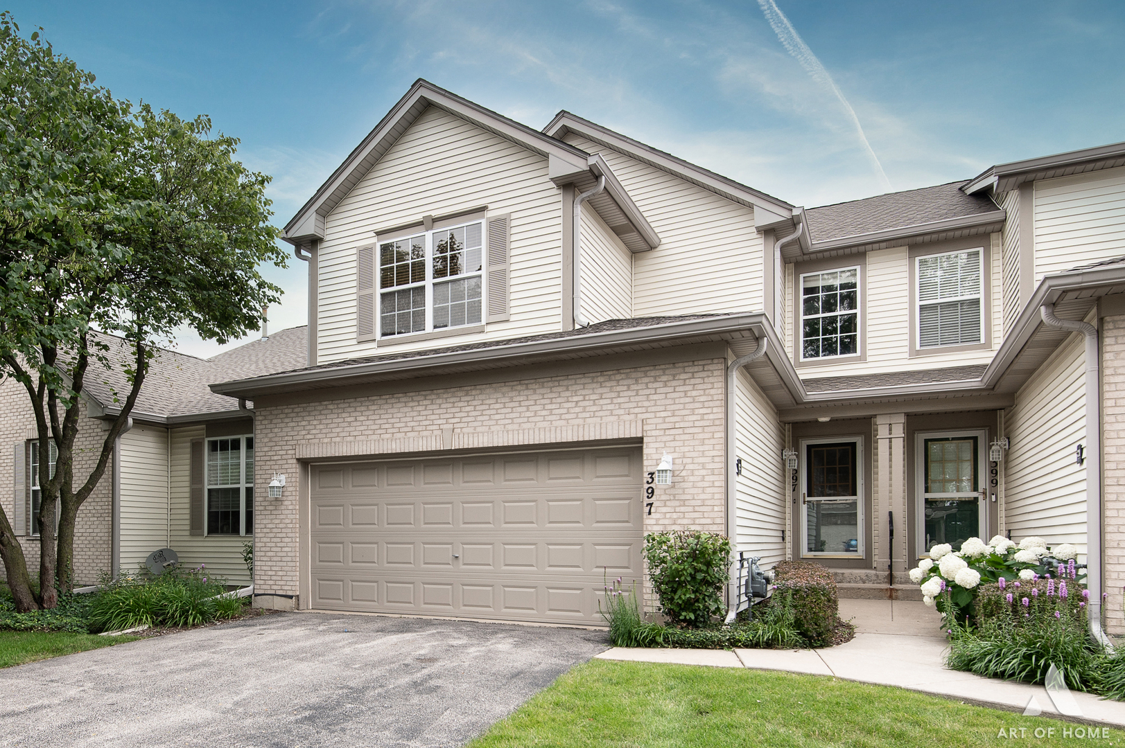 397 Littleton Trail Elgin, IL 60120 - Photo 1 of 30 a front view of a house with a yard and garage
