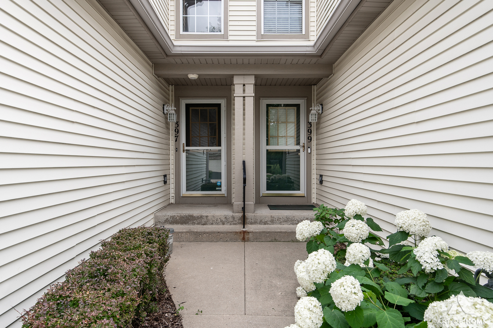 397 Littleton Trail Elgin, IL 60120 - Photo 2 of 30 a potted plant sitting in front of a house