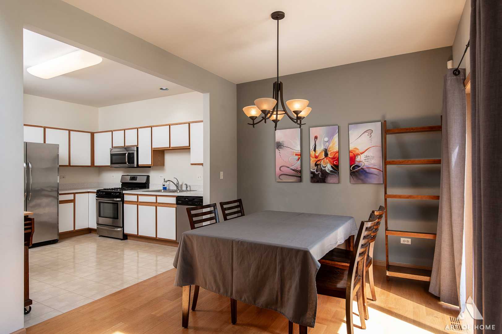 397 Littleton Trail Elgin, IL 60120 - Photo 8 of 30 a view of a dining room and a livingroom with furniture wooden floor a chandelier