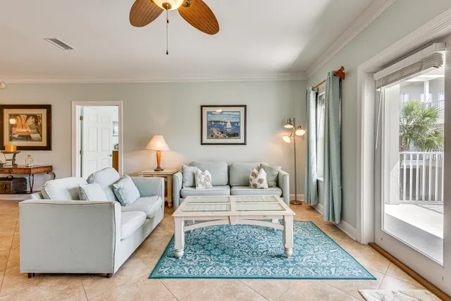 a living room with furniture and a rug