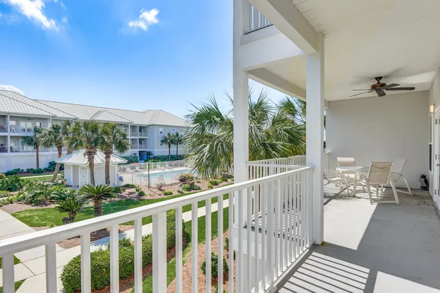 a view of a balcony with furniture