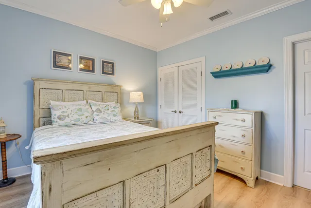a bedroom with a bed and a dresser