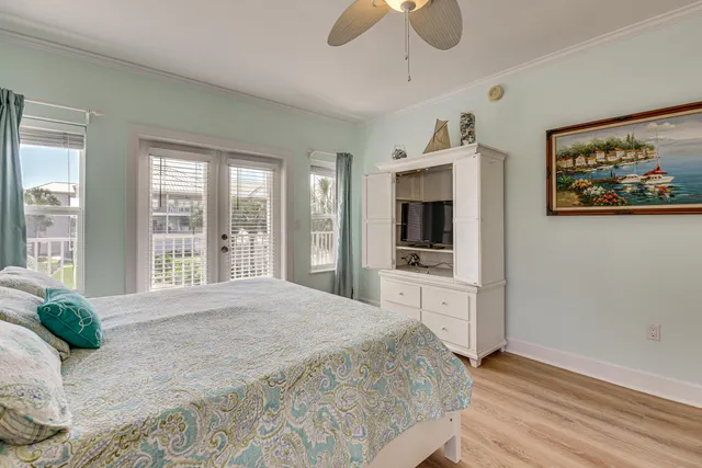 a spacious bedroom with a large bed and a flat screen tv