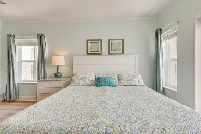 a bedroom with a large bed and a window