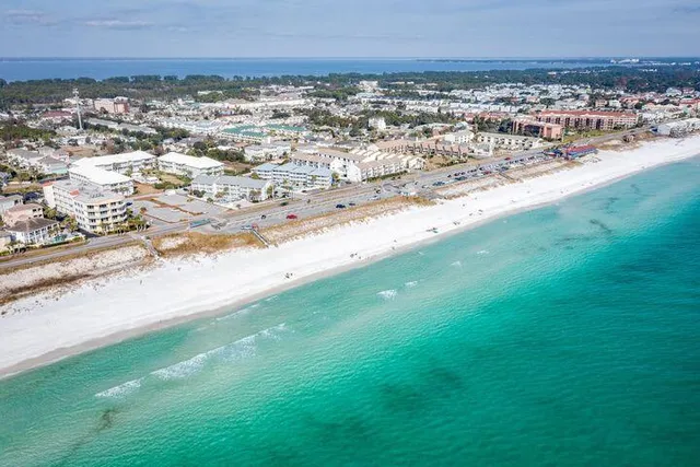 an aerial view of a house with a ocean view