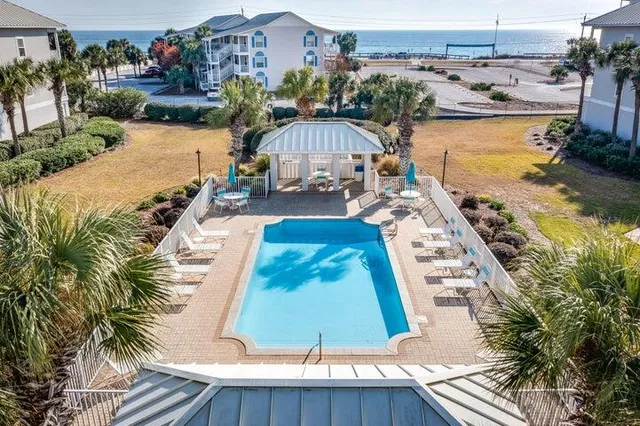 an aerial view of residential houses with outdoor space