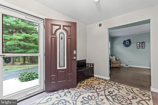 a kitchen with cabinets appliances and a window