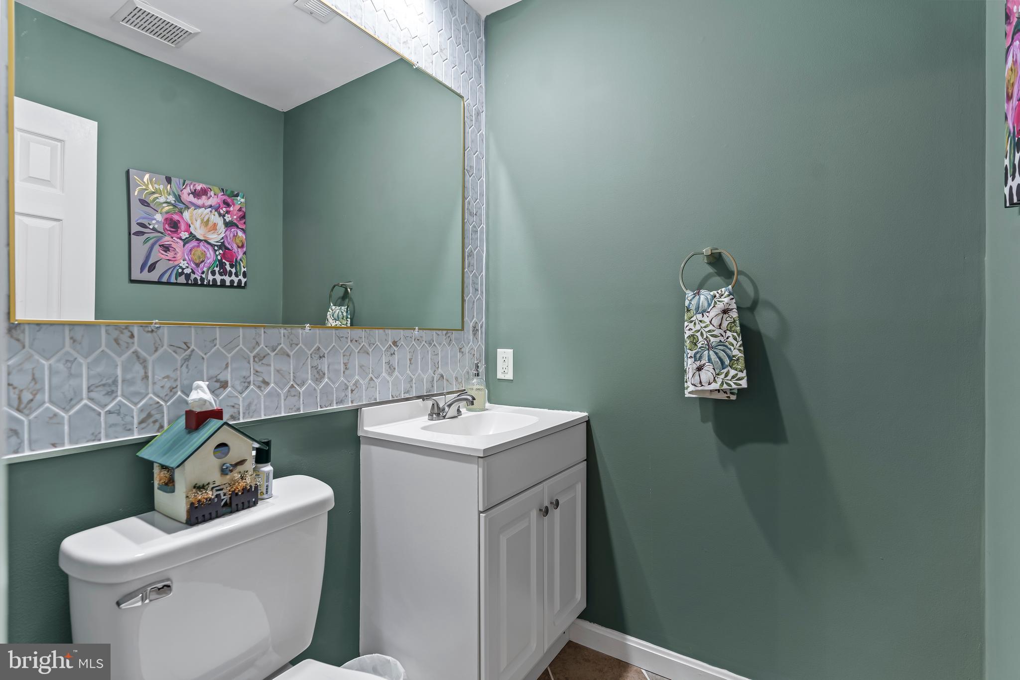 18347 Manor Church Road Boonsboro, MD 21713 - Photo 12 of 70 a bathroom with a toilet sink and mirror