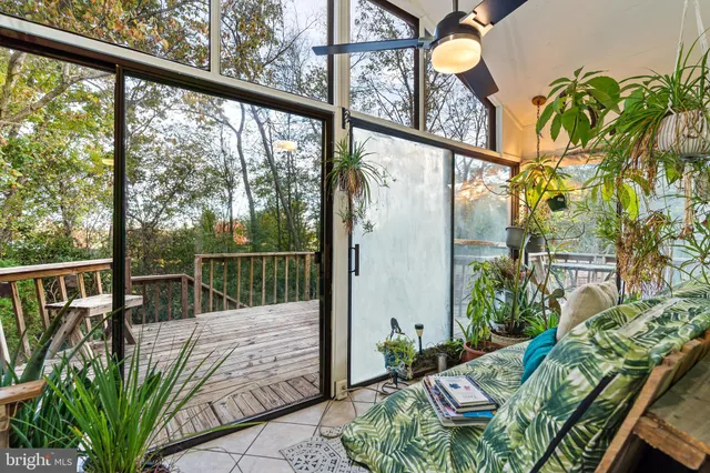 a room with gym equipment and a large window