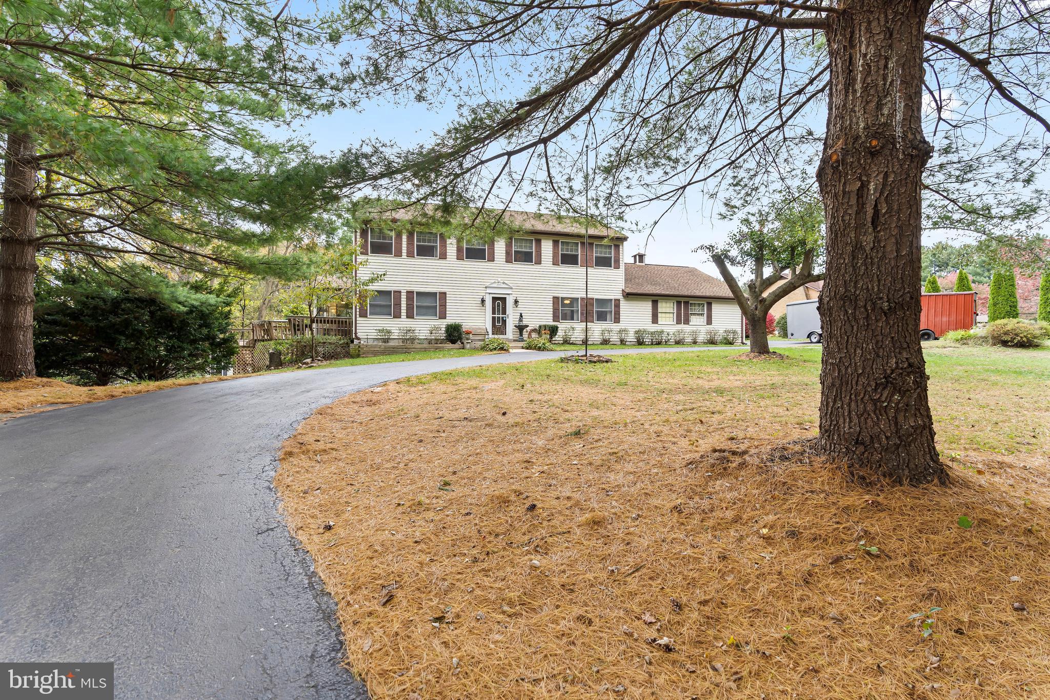 18347 Manor Church Road Boonsboro, MD 21713 - Photo 3 of 70 a front view of a house with a yard and trees