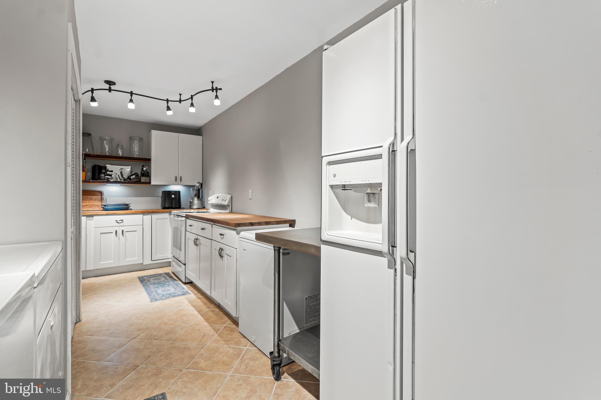 18347 Manor Church Road Boonsboro, MD 21713 - Photo 49 of 70 a kitchen with stainless steel appliances granite countertop a sink and cabinets