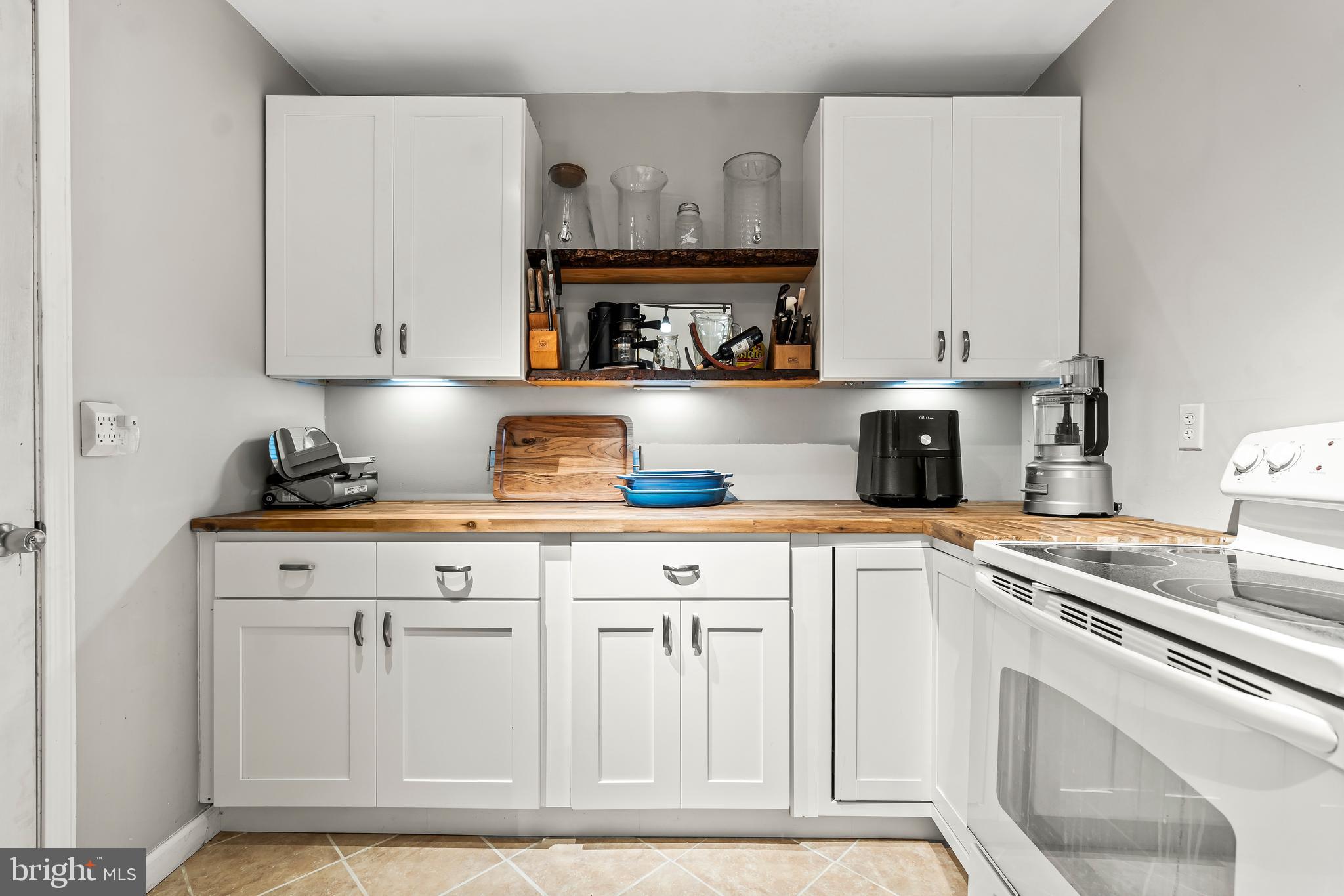 18347 Manor Church Road Boonsboro, MD 21713 - Photo 50 of 70 a kitchen with white cabinets and sink