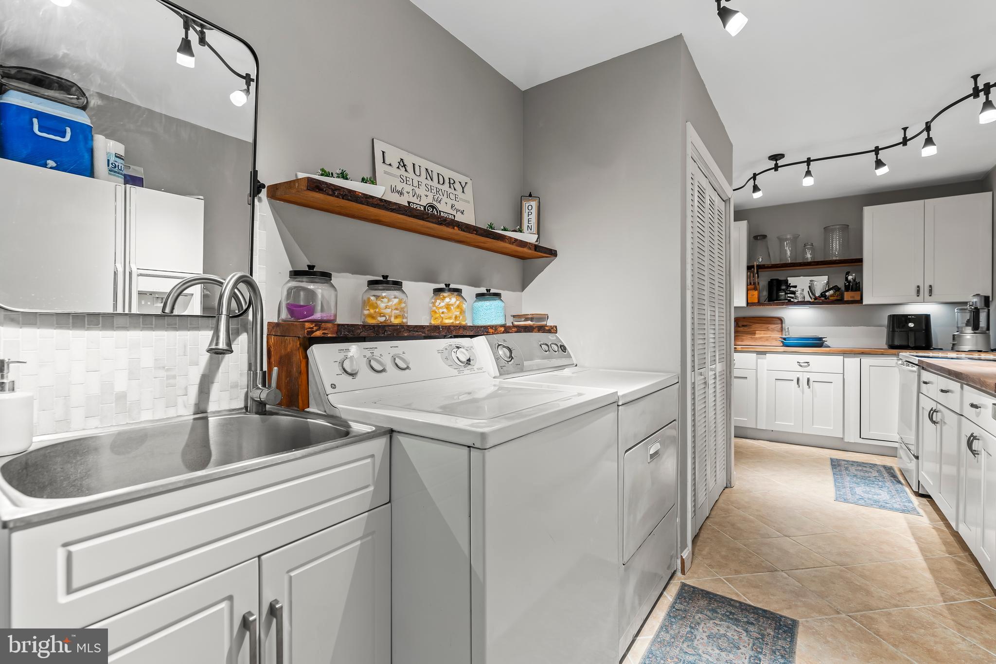 18347 Manor Church Road Boonsboro, MD 21713 - Photo 51 of 70 a kitchen that has a sink and cabinets in it