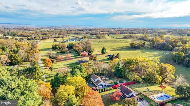 a view of a house with a yard and garage