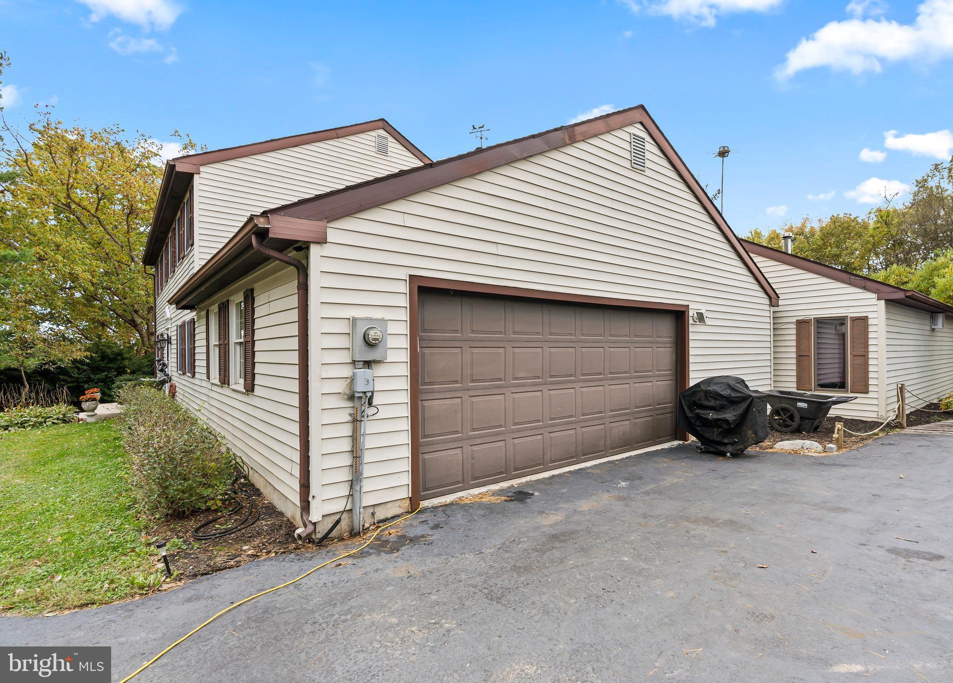 18347 Manor Church Road Boonsboro, MD 21713 - Photo 10 of 70 a view of a house with a yard and garage