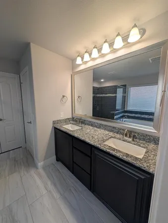 a bathroom with a tub and a shower