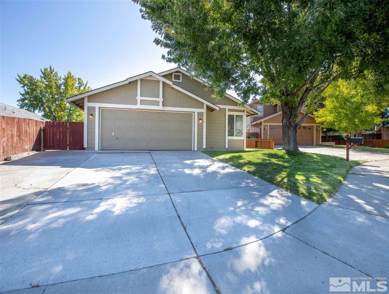 1114 Indian Cove Way Reno, NV 89523 - Photo 3 of 17 a front view of house with yard and trees around