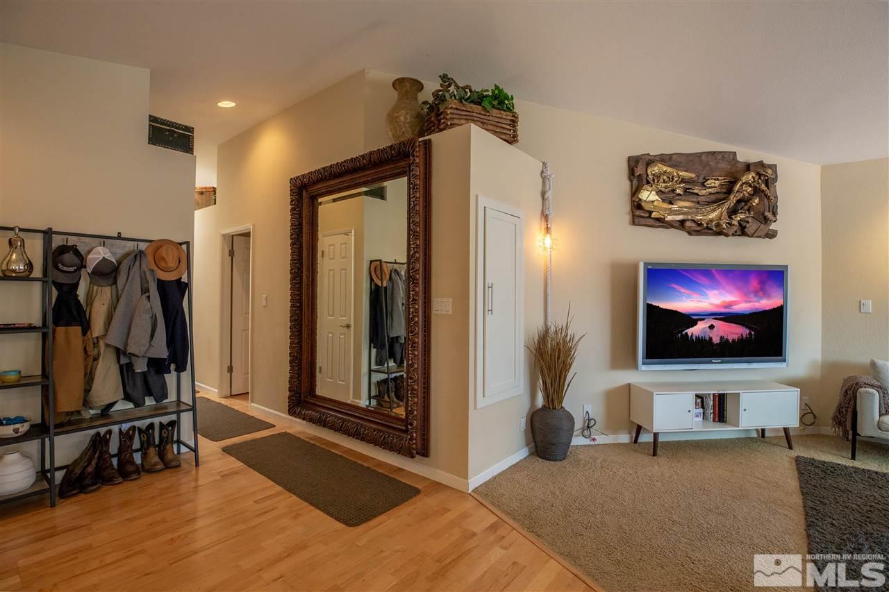 1114 Indian Cove Way Reno, NV 89523 - Photo 6 of 17 a view of a livingroom with furniture and a flat screen tv