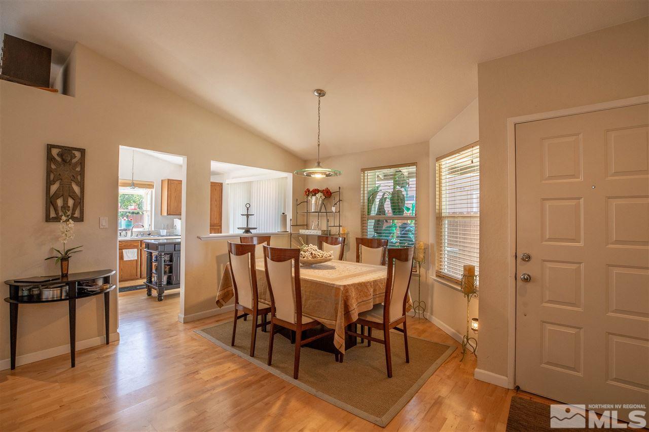 1114 Indian Cove Way Reno, NV 89523 - Photo 7 of 17 a view of a a dining room with furniture window and wooden floor