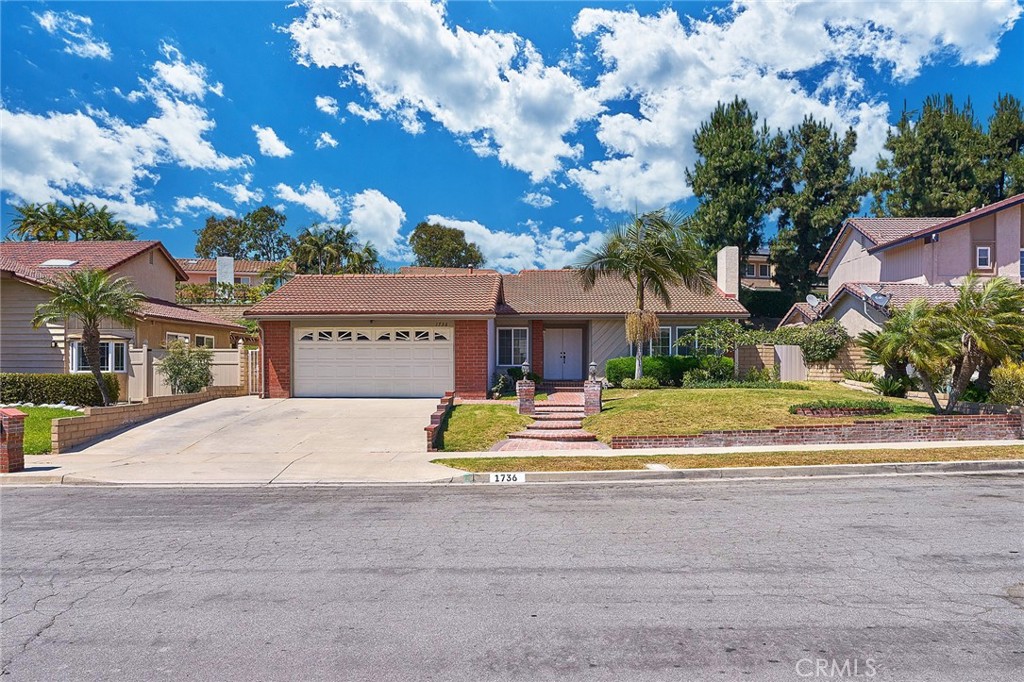 1736 Kingham Way Fullerton, CA 92833 - Photo 1 of 1 a view of street with yellow house