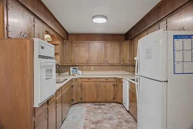 a kitchen with a refrigerator a sink and dishwasher
