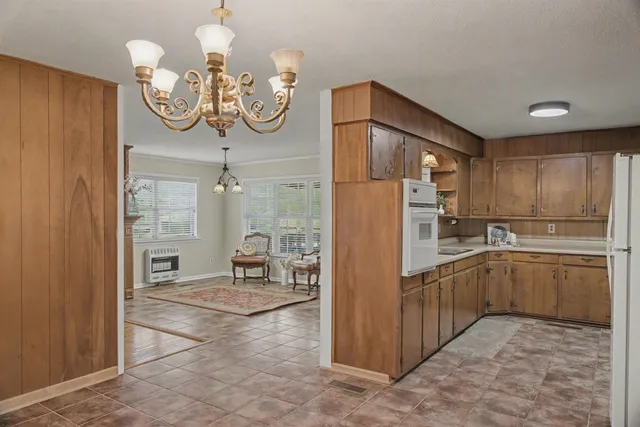 a kitchen with cabinets and stainless steel appliances