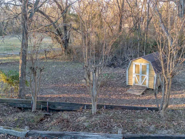 a backyard of a house with lots of green space