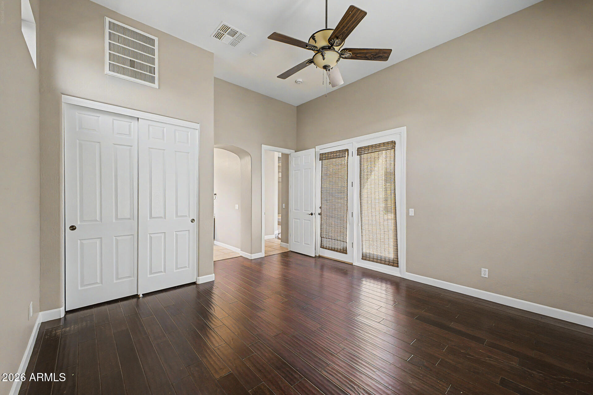 4046 North Silver Ridge Circle Mesa, AZ 85207 - Photo 33 of 61 an empty room with wooden floor ceiling fan
