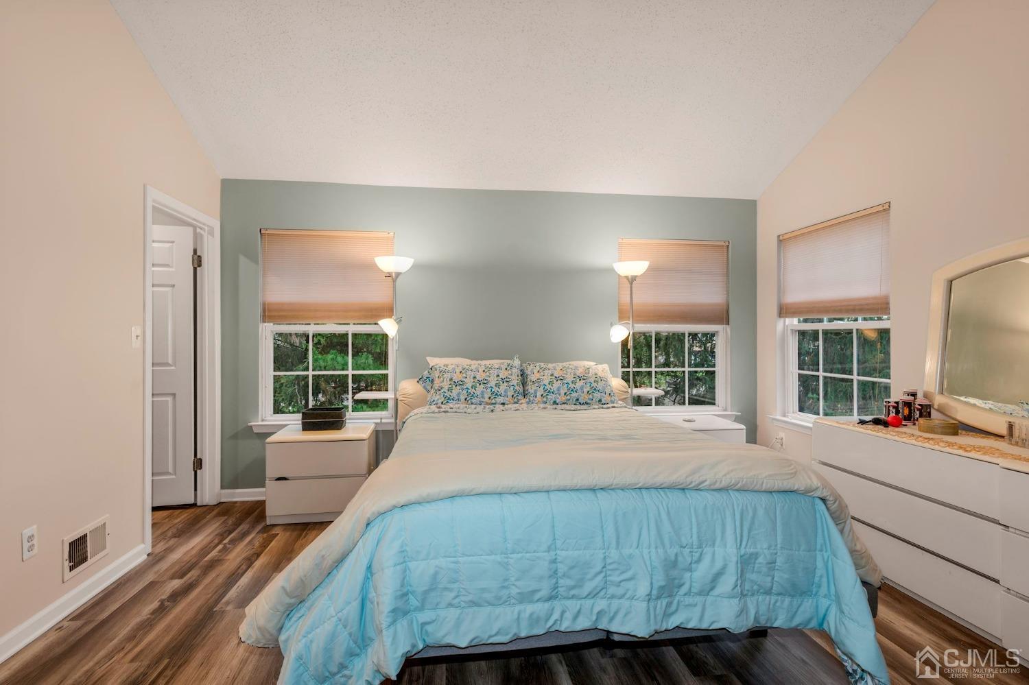 58 Nova Drive Piscataway, NJ 08854 - Photo 11 of 16 a bedroom with a bed and glass windows