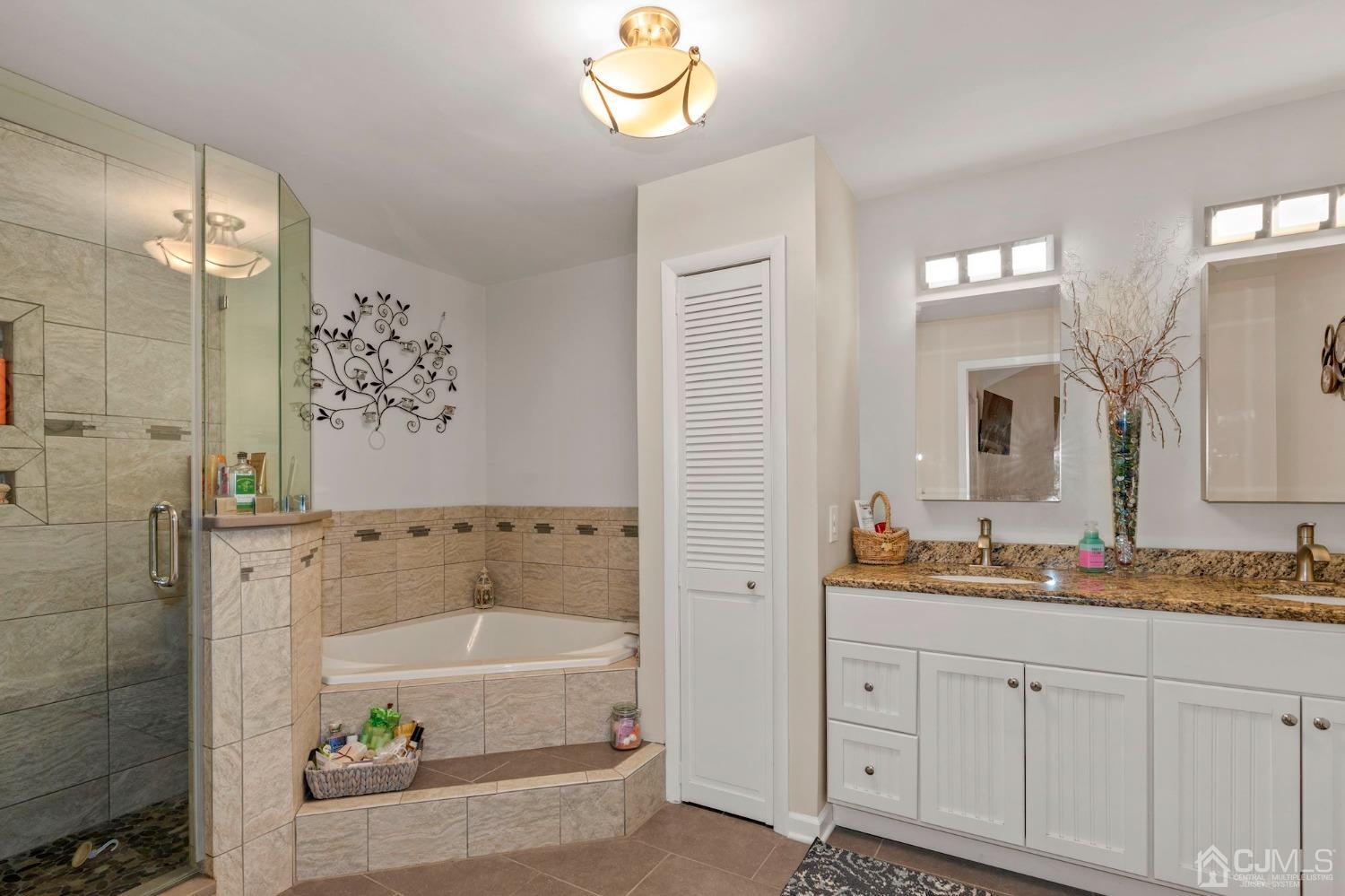 58 Nova Drive Piscataway, NJ 08854 - Photo 14 of 16 a bathroom with a granite countertop sink mirror and bathtub