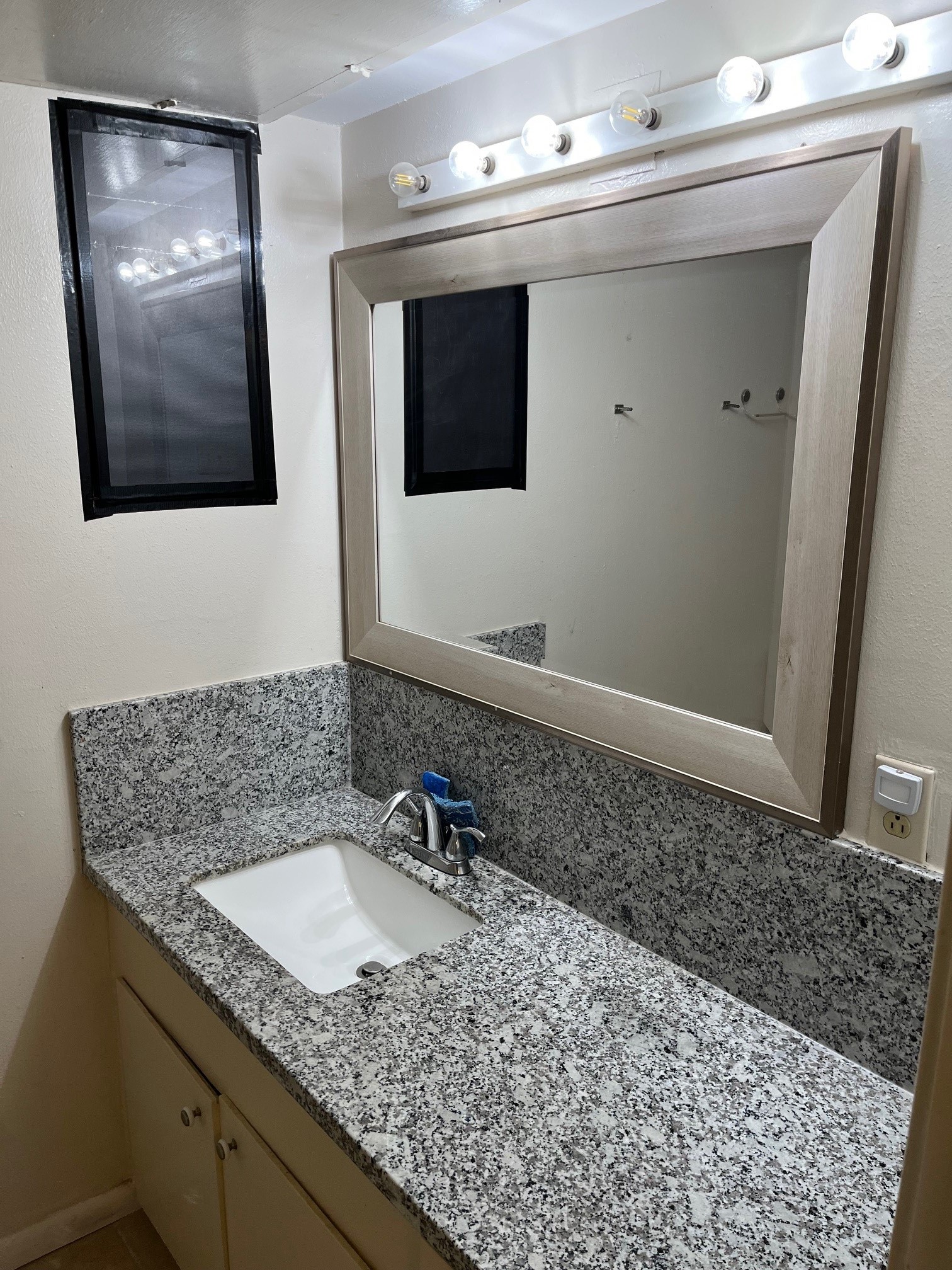 3938 West Alabama Street, Unit 12 Houston, TX 77027 - Photo 16 of 25 Updated bathroom vanity with granite countertops, framed mirror & modern fixtures.