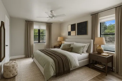 a bedroom with a large bed and a window