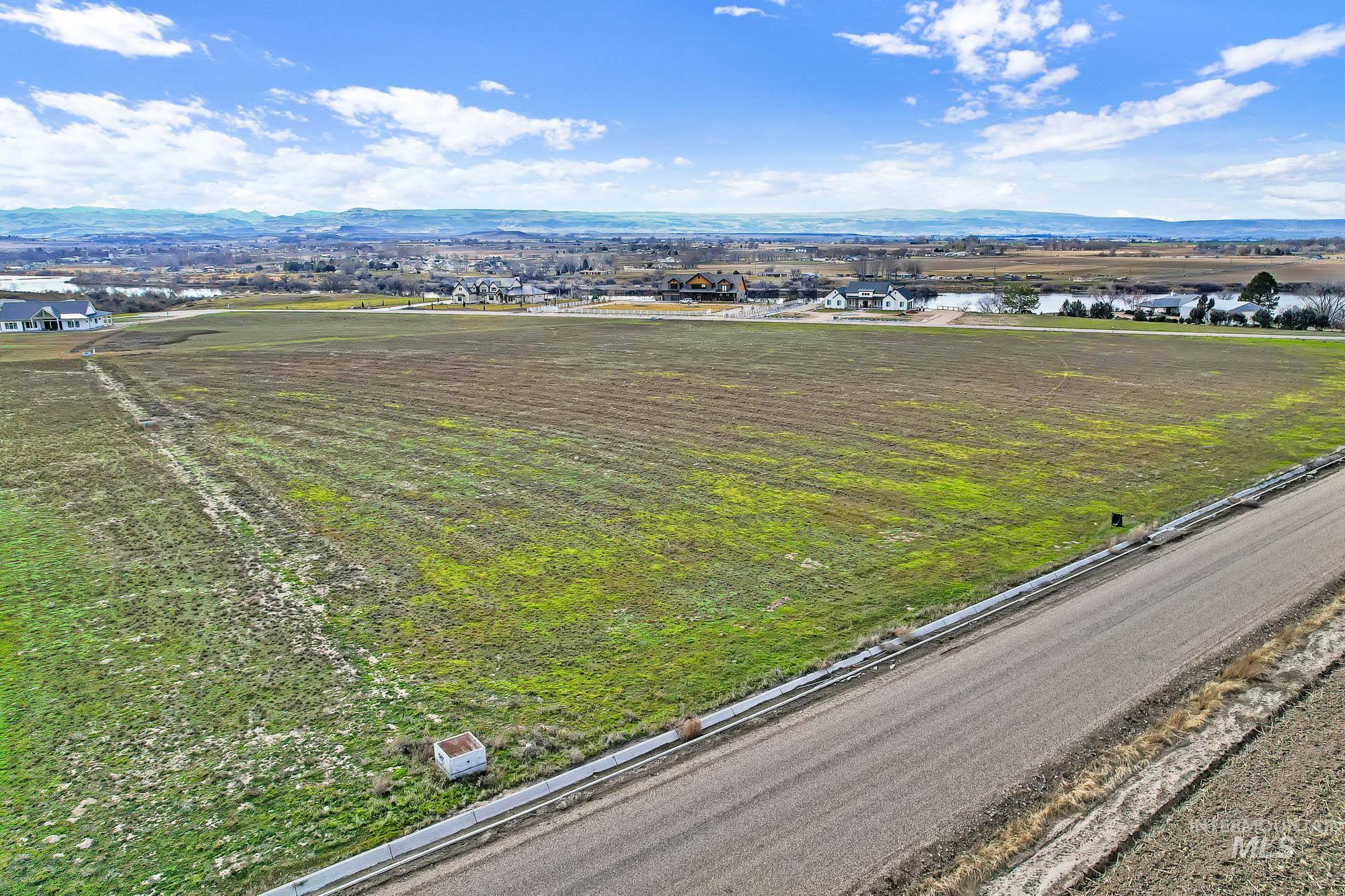 Tbd Tbd Cabernet Lane Caldwell, ID 83607 - Photo 3 of 15 Aerial view of sparsely populated area with mountains and large plots for crops