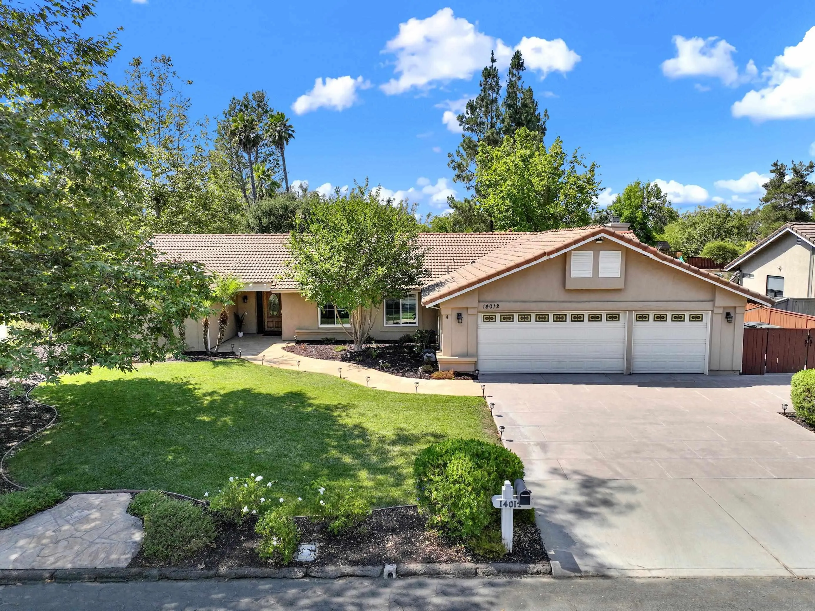 14012 Valley Springs Road Poway, CA 92064 - Photo 2 of 57 a view of a house with a yard and potted plants